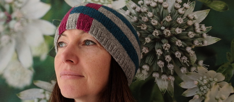 Pink, grey and blue hat made using intarsia knitting technique - pattern name is Abelona