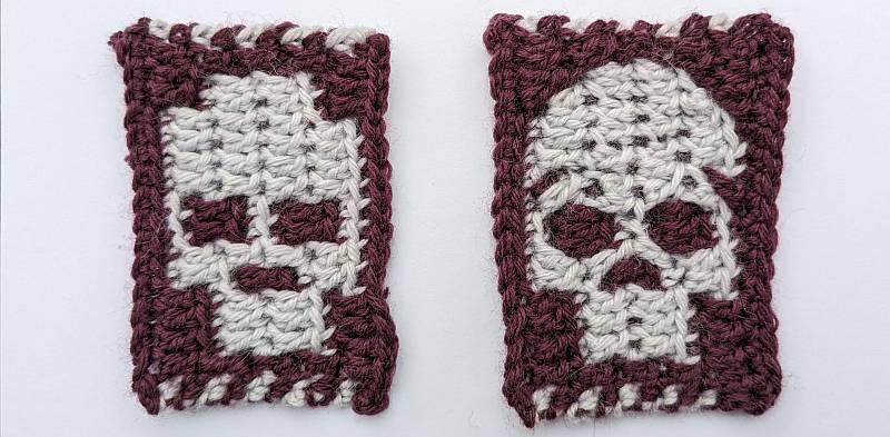 Two crochet swatches of white skulls on dark backgrounds. One has a blocky, pixelated look, while the other has a rounded top to the skull and round eyes